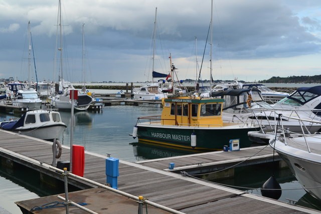 Boats berthed beside floating pontoons in Poole